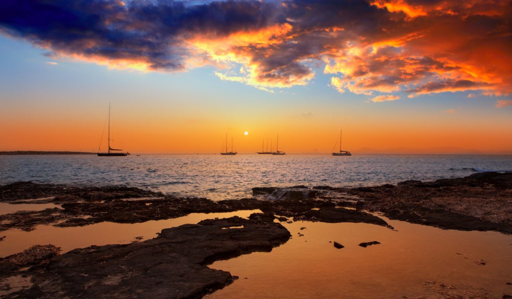 properly lit sailboat at night picture