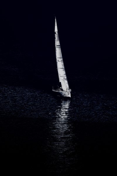 properly lit sailboat at night picture