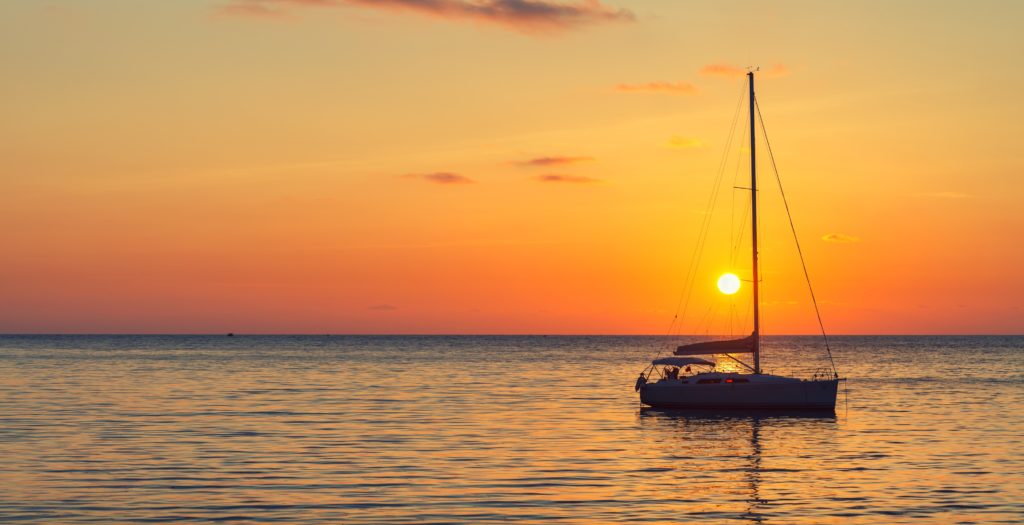 properly lit sailboat at night picture